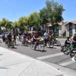 Group of cyclists stopped at traffic lights